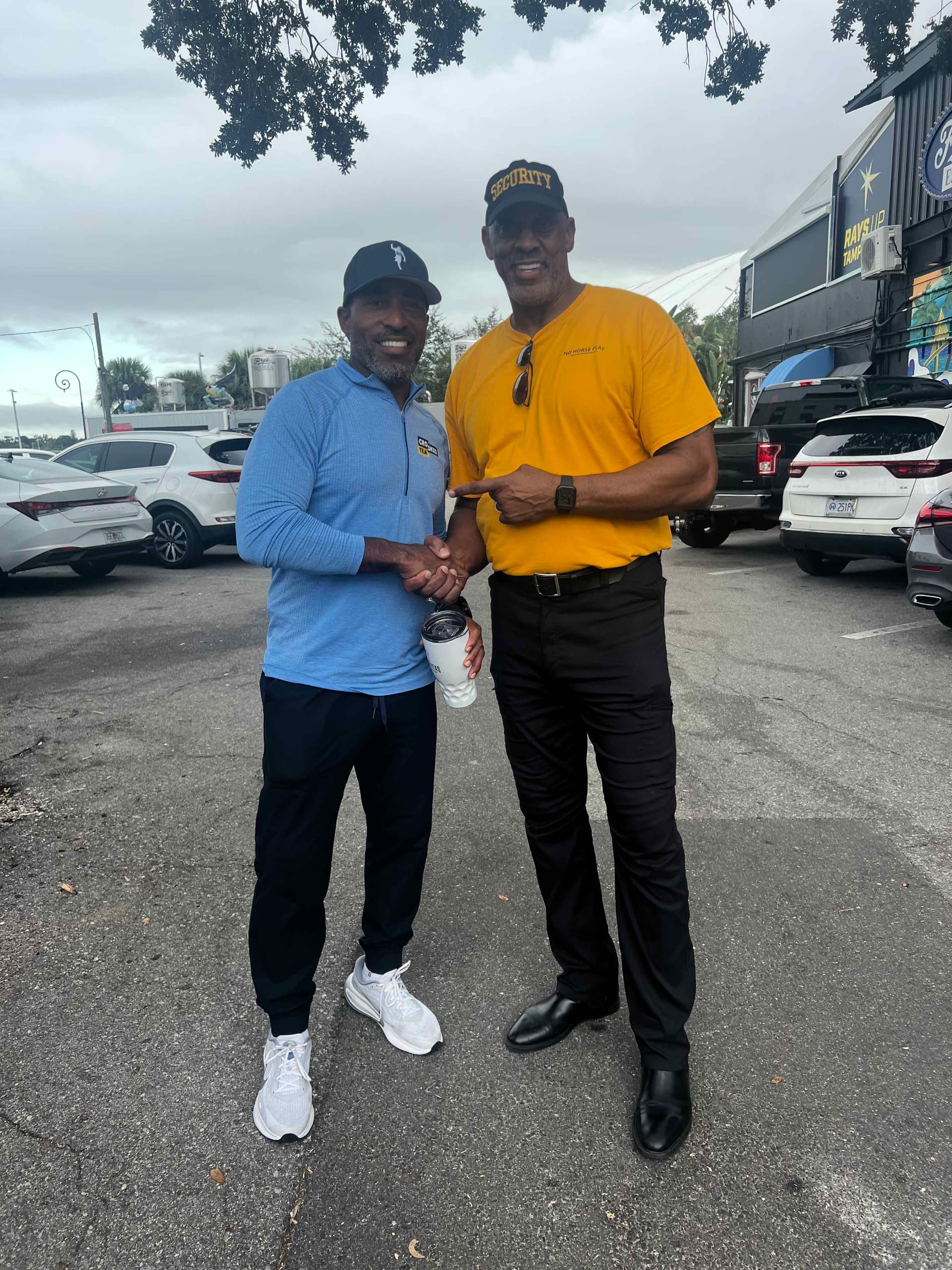 Rod Kittles greeting a guest while wearing a No Horseplay security cap